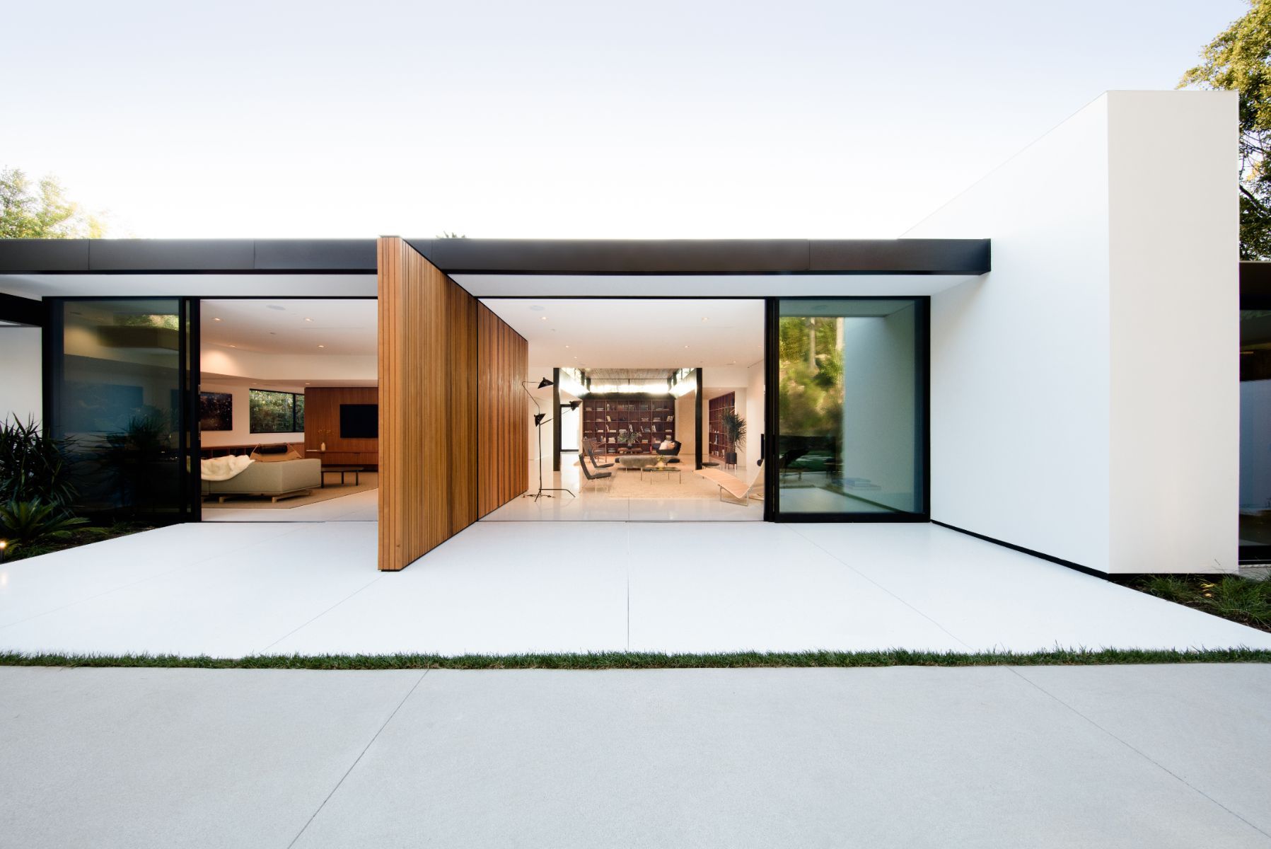 Entry pivot door and motor court